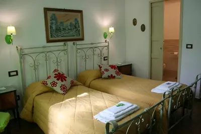 Letto o letti in una camera di b&b Duca d'Aosta