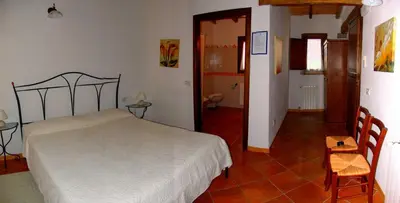 Letto o letti in una camera di Agriturismo Li Scopi
