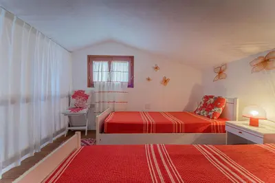 Letto o letti in una camera di coda cavallo villaggio cala paradiso villino C4