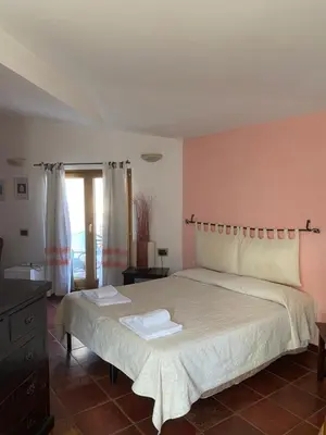 Letto o letti in una camera di Locanda Tipica Sa Corte