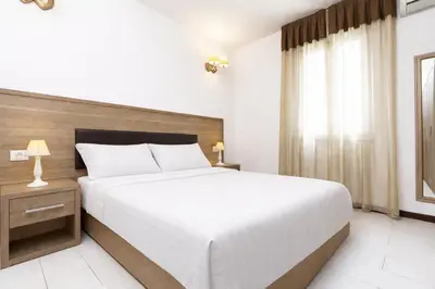 Letto o letti in una camera di Le Residenze del Centro