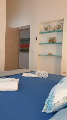 Letto o letti in una camera di B&B Cala Luna
