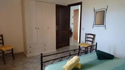 Letto o letti in una camera di Sa Pira