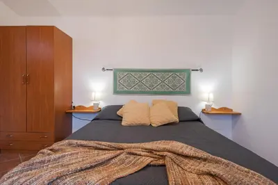 Letto o letti in una camera di S'Ulumu