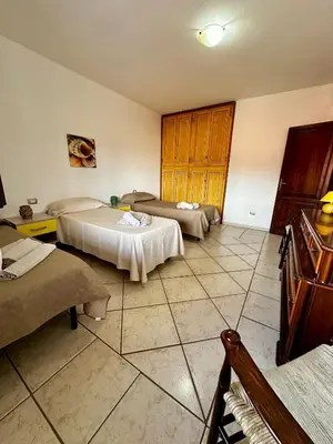 Letto o letti in una camera di Amazing Suite Olbia