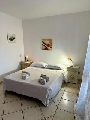 Letto o letti in una camera di Amazing Suite Olbia