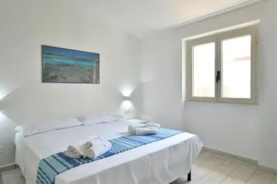 Letto o letti in una camera di Biriola EcoResort Cala Gonone