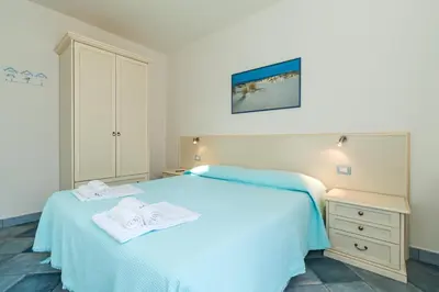 Letto o letti in una camera di Biriola EcoResort Cala Gonone