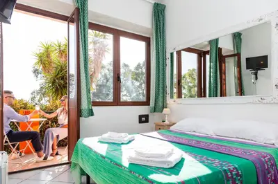 Letto o letti in una camera di Helios Hotel