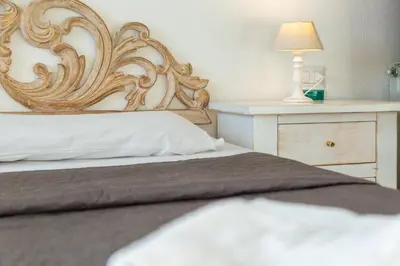 Letto o letti in una camera di Helios Hotel