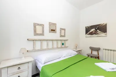 Letto o letti in una camera di Helios Hotel