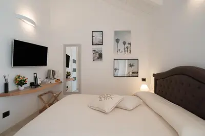 Letto o letti in una camera di Corso Umberto Rooms