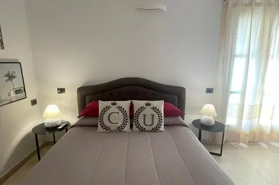 Letto o letti in una camera di Corso Umberto Rooms