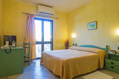 Letto o letti in una camera di Residenza Gli Ontani