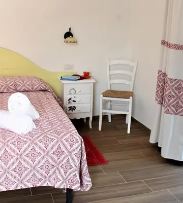 Letto o letti in una camera di Borgo Rurale Cares