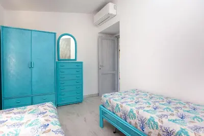 Letto o letti in una camera di Residence La Cinta