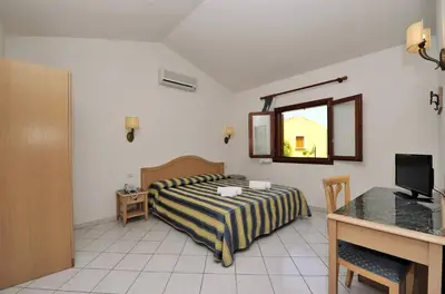 Letto o letti in una camera di Hotel Cala Mirto