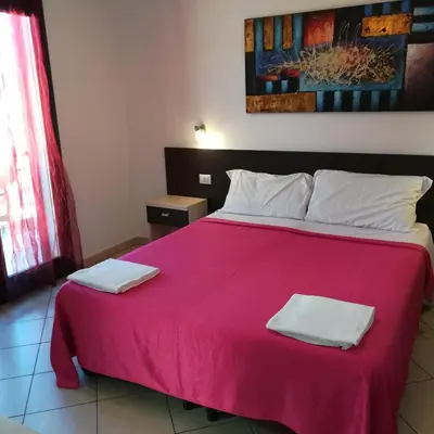Letto o letti in una camera di La Locanda Del Mare -Domo- Affittacamere