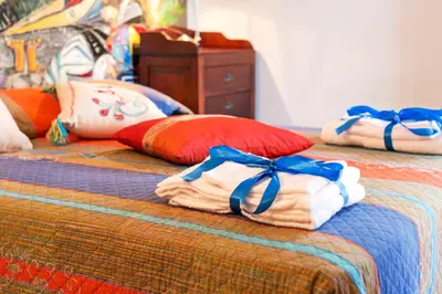 Letto o letti in una camera di Calagonone villetta con giardino e barbecue