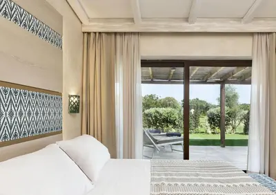 Letto o letti in una camera di Baglioni Resort Sardinia - The Leading Hotels of the World