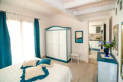 Letto o letti in una camera di Sant'Anna Charming Apartments