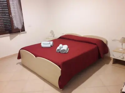 Letto o letti in una camera di Le rondini