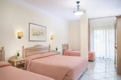 Letto o letti in una camera di Hotel Maria Rosaria