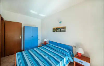 Letto o letti in una camera di Amazing Apartment In San Teodoro Ot
