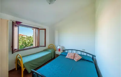 Letto o letti in una camera di Gorgeous Apartment In San Teodoro Ot