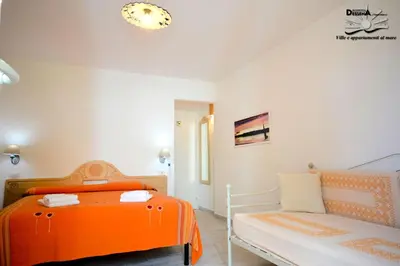 Letto o letti in una camera di Villa Dessena Guest House