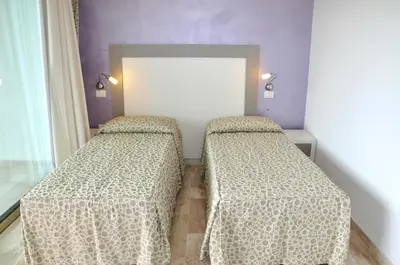 Letto o letti in una camera di Gil's Hotel