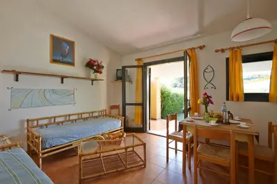 Letto o letti in una camera di Residence Baia Salinedda