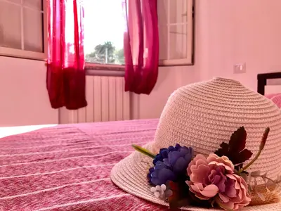 Letto o letti in una camera di Casa Dolce Hibiscus