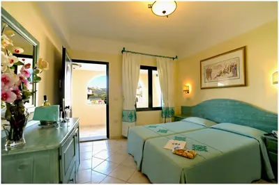 Letto o letti in una camera di Residence Cala Liberotto