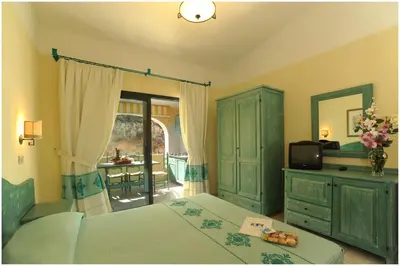 Letto o letti in una camera di Residence Cala Liberotto