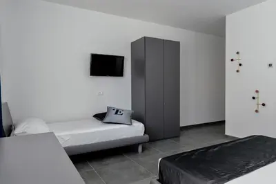 Letto o letti in una camera di L'Essenza Hotel