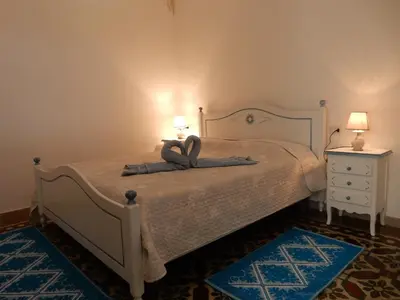Letto o letti in una camera di B&B Eleonora D'Arborea, Centro Storico