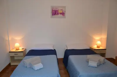 Letto o letti in una camera di Confortevole appartamento a pochi passi dal mare