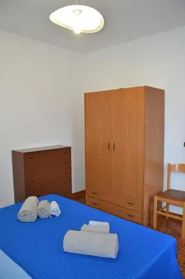 Letto o letti in una camera di Confortevole appartamento a pochi passi dal mare