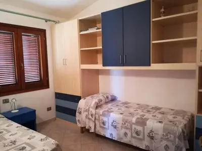 Letto o letti in una camera di Residence Le Canne