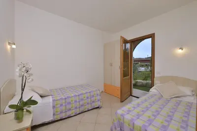 Letto o letti in una camera di Residence Le Zagare