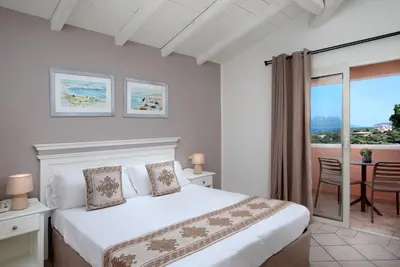 Letto o letti in una camera di VOI Colonna Village