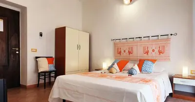 Letto o letti in una camera di Affittacamere Le Ginestre
