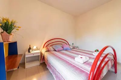 Letto o letti in una camera di Apartment in San Teodoro 23144