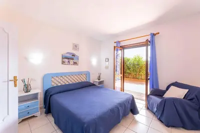 Letto o letti in una camera di Holiday home in Golfo Aranci 30357