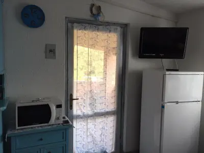 Cucina o angolo cottura di Bilocale Residence Gli Ulivi San Teodoro