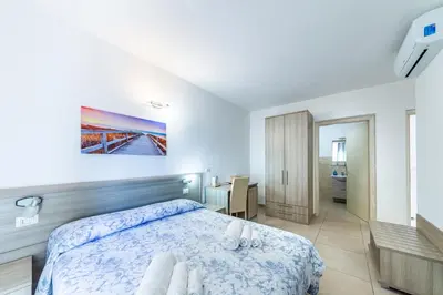 Letto o letti in una camera di Affittacamere Blue Sea