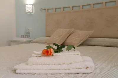 Letto o letti in una camera di Casa Berenice