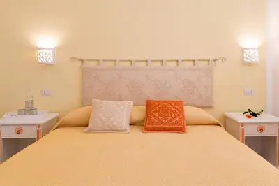 Letto o letti in una camera di Casa Berenice