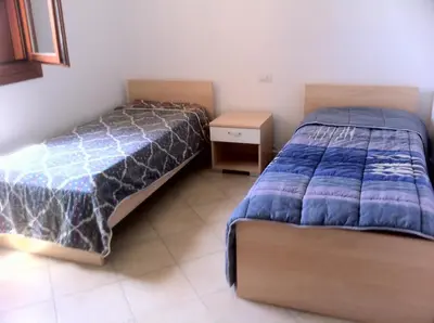 Letto o letti in una camera di Luna Case Vacanza